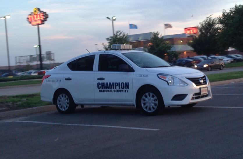 Champion Security Car Parked in Parking Lot